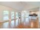Bright living room featuring kitchen, vaulted ceiling, hardwood floors, and lots of light at 3830 Gallant Fox Ct, Duluth, GA 30096