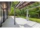 Spacious backyard featuring a covered patio and well-maintained lawn at 6878 Brandon Mill Rd, Sandy Springs, GA 30328