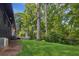 Lush backyard showing the lawn, exterior, deck, and a/c unit at 6878 Brandon Mill Rd, Sandy Springs, GA 30328