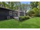 Well-kept backyard showing the deck and lush landscaping at 6878 Brandon Mill Rd, Sandy Springs, GA 30328