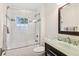 Bathroom with tile flooring, glass shower door, and a dark vanity at 6878 Brandon Mill Rd, Sandy Springs, GA 30328