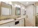 This bathroom boasts double sinks, a shower with glass door, and neutral color tones at 6878 Brandon Mill Rd, Sandy Springs, GA 30328