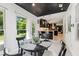Charming breakfast nook with modern decor, bright windows, and an adjacent kitchen view at 6878 Brandon Mill Rd, Sandy Springs, GA 30328