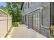 Exterior of house showing patio, brick, and fence to the yard at 6878 Brandon Mill Rd, Sandy Springs, GA 30328