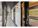 Covered front porch with a modern front door with textured glass and a smart lock at 6878 Brandon Mill Rd, Sandy Springs, GA 30328