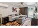 Comfortable living room with a large sectional sofa and sliding doors to the backyard at 6878 Brandon Mill Rd, Sandy Springs, GA 30328