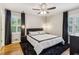 Calming main bedroom with stylish decor, black-out curtains, and ample natural light at 6878 Brandon Mill Rd, Sandy Springs, GA 30328