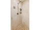 This shower features a tiled floor, built-in shelving, and a hand-held shower head at 6878 Brandon Mill Rd, Sandy Springs, GA 30328