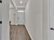 Entryway hallway features wood-look floors and a white front door at 1054 Mackets Ct, Atlanta, GA 30354