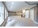 Large finished basement with carpet, multiple windows, recessed lighting, and white doors at 265 Landfall Rd, Atlanta, GA 30328