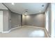 Cozy basement area featuring gray walls, carpet, recessed lights, and window at 265 Landfall Rd, Atlanta, GA 30328