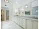 Bathroom featuring double vanity sinks with marble countertops and a view of the glass shower at 265 Landfall Rd, Atlanta, GA 30328