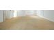 Spacious bedroom with neutral carpet, white walls, and bright natural light from multiple windows at 265 Landfall Rd, Atlanta, GA 30328