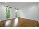 Bright, empty bedroom with hardwood floors and neutral walls, ready for personal touches at 265 Landfall Rd, Atlanta, GA 30328