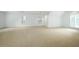 Spacious bedroom with neutral carpet, white walls, and bright natural light from multiple windows at 265 Landfall Rd, Atlanta, GA 30328