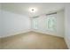 Bright bedroom with carpet, two windows with shutters, and a neutral color scheme at 265 Landfall Rd, Atlanta, GA 30328