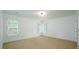 Neutral bedroom with carpet, two windows with shutters, and a minimal aesthetic at 265 Landfall Rd, Atlanta, GA 30328