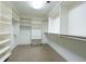 Walk-in closet offering ample shelving, multiple racks and built-in drawers at 265 Landfall Rd, Atlanta, GA 30328