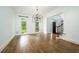 Dining room with hardwood floors and view of the front door and staircase at 265 Landfall Rd, Atlanta, GA 30328
