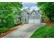 Charming two-story traditional home with landscaped front yard and a two-car garage at 265 Landfall Rd, Atlanta, GA 30328