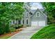 Charming two-story traditional home with landscaped front yard and a two-car garage at 265 Landfall Rd, Atlanta, GA 30328