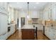 Spacious kitchen with granite counters, stainless appliances, tile backsplash, and island seating at 265 Landfall Rd, Atlanta, GA 30328