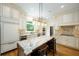 Spacious kitchen with a large island, stainless steel appliances, and custom cabinetry at 265 Landfall Rd, Atlanta, GA 30328