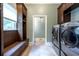 Laundry room with stainless steel washer and dryer, storage, and a window at 265 Landfall Rd, Atlanta, GA 30328