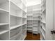Spacious walk-in closet with multiple shelves and storage baskets at 265 Landfall Rd, Atlanta, GA 30328