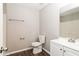 Clean bathroom featuring a modern vanity, toilet, and updated fixtures at 5612 Festival Ave, Fairburn, GA 30213