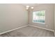Cozy dining area featuring a chandelier and a large window for natural light at 5612 Festival Ave, Fairburn, GA 30213