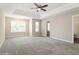 Spacious main bedroom with tray ceiling, neutral walls, and plenty of space at 5612 Festival Ave, Fairburn, GA 30213