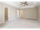Large main bedroom featuring a walk-in closet and ensuite bathroom access at 5612 Festival Ave, Fairburn, GA 30213