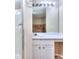 Bathroom vanity and mirror with a shower in the background at 5640 Terremont Cir, Norcross, GA 30093