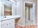 Bathroom with updated vanity, sink, and a glimpse of the shower/tub area at 5640 Terremont Cir, Norcross, GA 30093