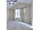 Large bedroom with vaulted ceiling, neutral walls, carpet, and natural light from a window at 5640 Terremont Cir, Norcross, GA 30093