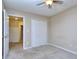 Comfortable bedroom with neutral carpet and an adjacent closet with ample storage space at 5640 Terremont Cir, Norcross, GA 30093