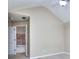 Neutral bedroom with ceiling fan, and adjoining ensuite bathroom and ample natural light at 5640 Terremont Cir, Norcross, GA 30093