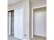 This is a closet featuring bi-fold doors and shelving at 5640 Terremont Cir, Norcross, GA 30093