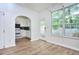 Spacious dining room, adjacent to the kitchen, with wood floors and a door to the outside at 5640 Terremont Cir, Norcross, GA 30093