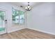 Bright dining area featuring wood floors, white trim, and natural light from a large window at 5640 Terremont Cir, Norcross, GA 30093