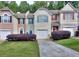 Charming townhomes with colorful shutters, well-manicured lawn and inviting curb appeal at 5640 Terremont Cir, Norcross, GA 30093