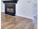 Fireplace with wood trim and new flooring in the living area at 5640 Terremont Cir, Norcross, GA 30093