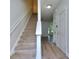 Bright foyer featuring stairs and new vinyl plank flooring at 5640 Terremont Cir, Norcross, GA 30093