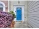 Close-up of the front door and manicured landscaping outside of the home at 5640 Terremont Cir, Norcross, GA 30093