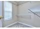 Bright walk-in closet featuring adjustable shelving and a window for natural light at 5640 Terremont Cir, Norcross, GA 30093