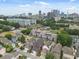 Stunning aerial view showcasing the neighborhood with modern townhouses and lush greenery against the city skyline at 121 Fulton Se Way, Atlanta, GA 30312