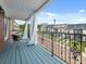 Charming outdoor balcony with blue wood flooring, iron railing, and views of the neighborhood street at 121 Fulton Se Way, Atlanta, GA 30312