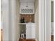 Compact, stylish bar area with white cabinetry, countertop and backsplash at 121 Fulton Se Way, Atlanta, GA 30312