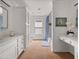 Spacious bathroom with double vanity, white cabinets and drawers, and a separate toilet and shower area at 121 Fulton Se Way, Atlanta, GA 30312